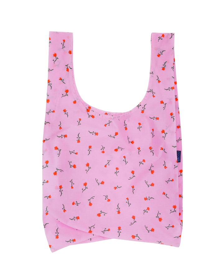 Pink reusable bag with floral pattern on a white background